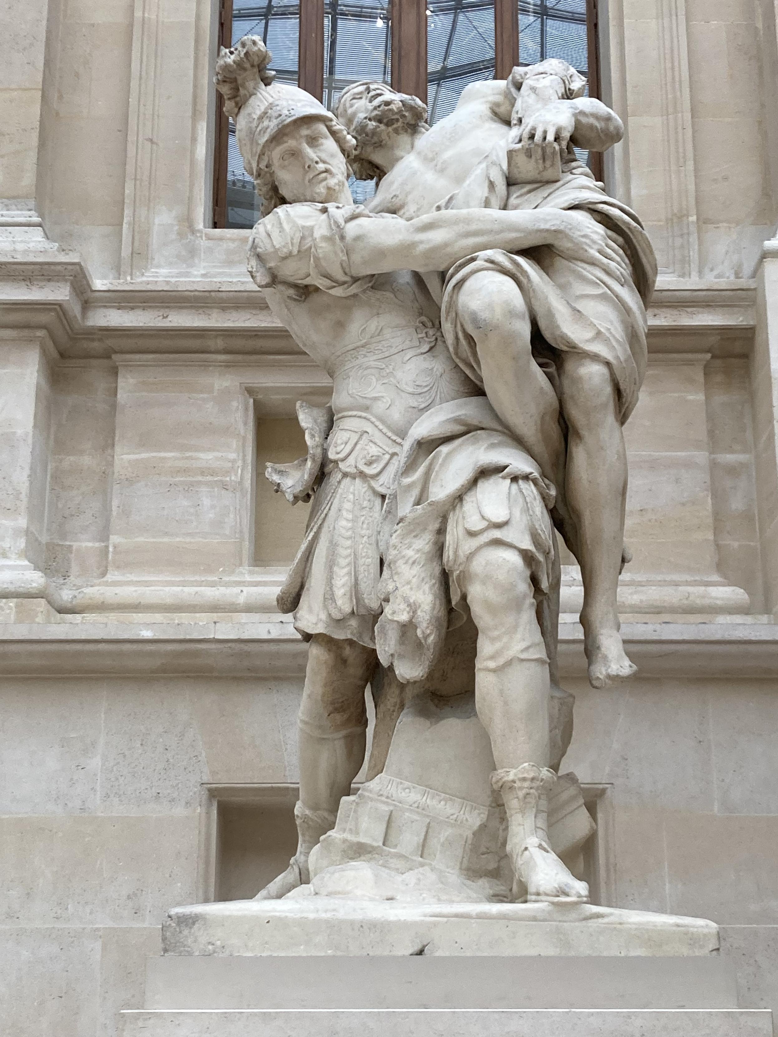 Statue d’un homme en portant un autre, qui tente de se débattre